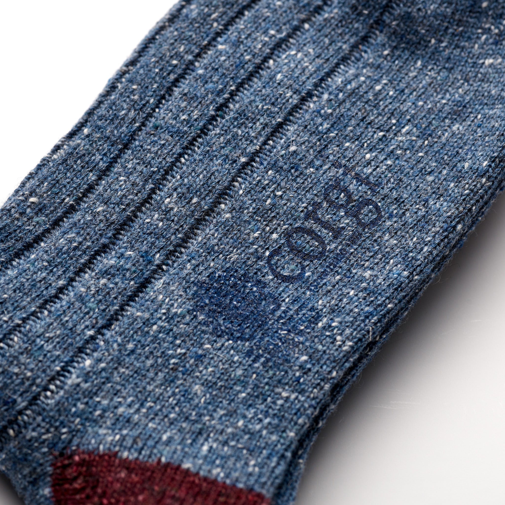 Corgi Heavyweight Colour Block Donegal Socks in Denim & Port foot logo and knit texture close-up