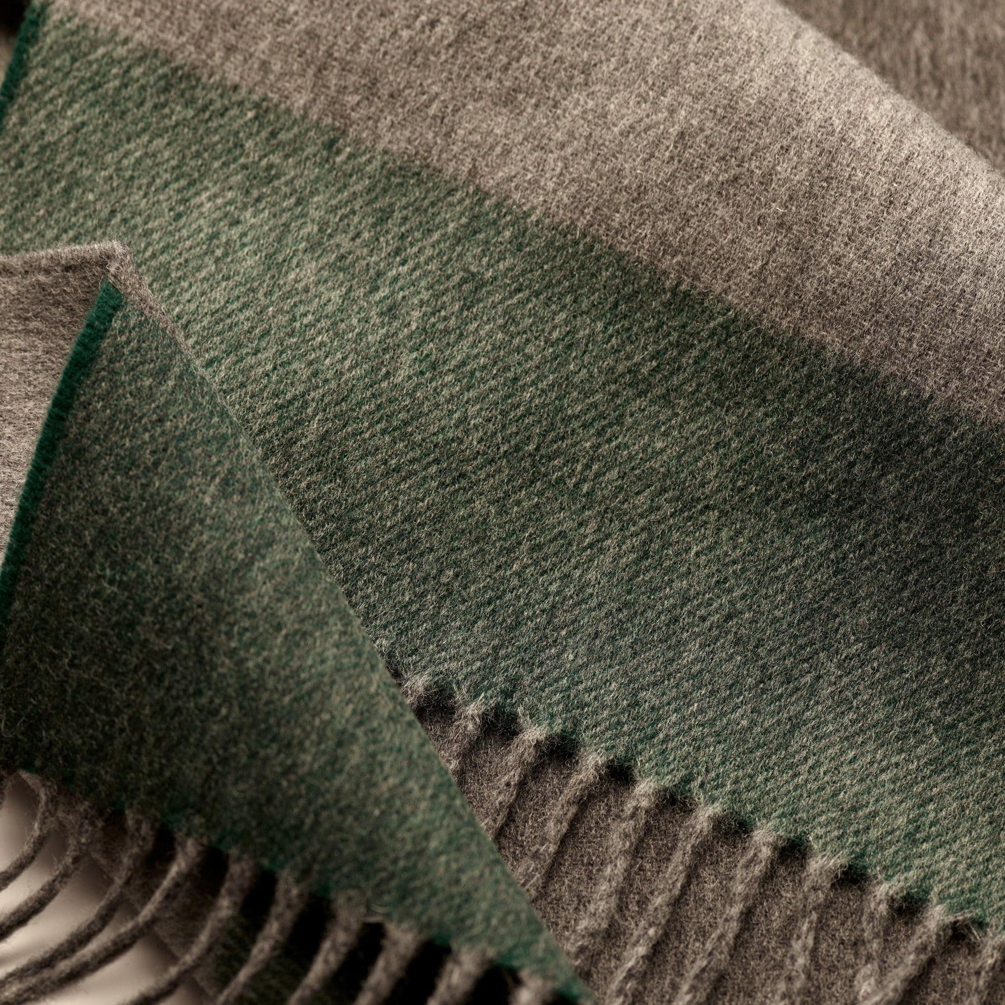 Close-up of brushed cashmere and wool cloth in grey and green