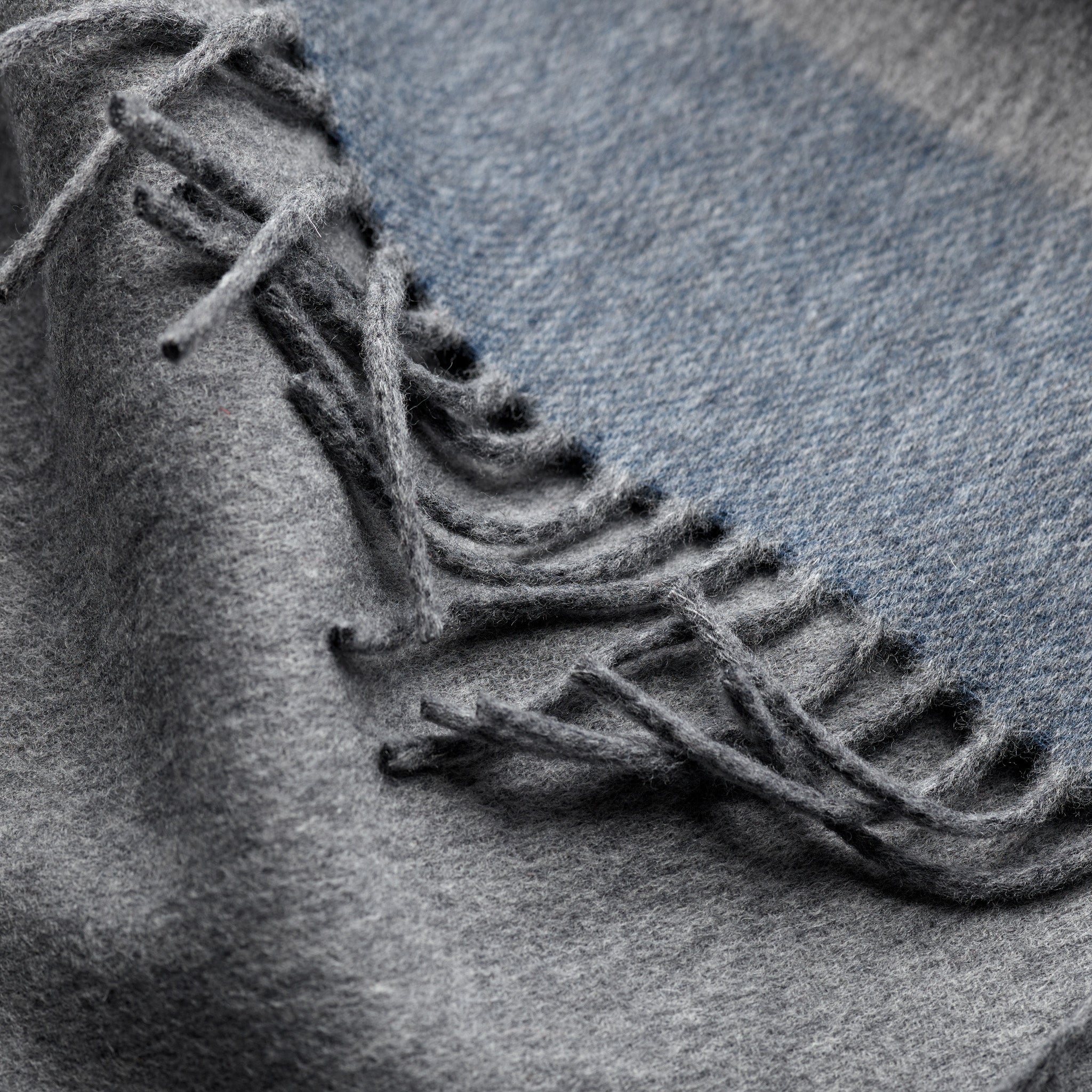 Fringe detail of Fox grey and blue cashmere and wool brushed scarf