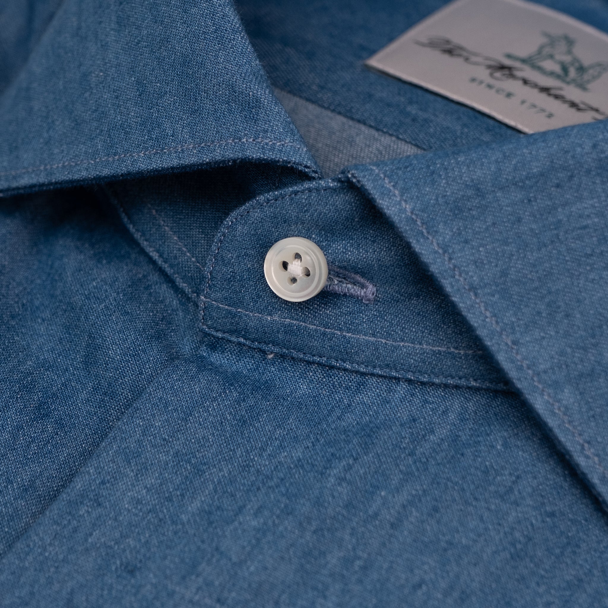 The Niven Fox Weekend Mid Wash Denim Shirt button detail